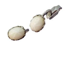 Vintage white star cabachon clip-on earrings in silver-tone hardware.